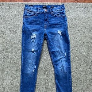 Supplies high rise distressed skinny jeans